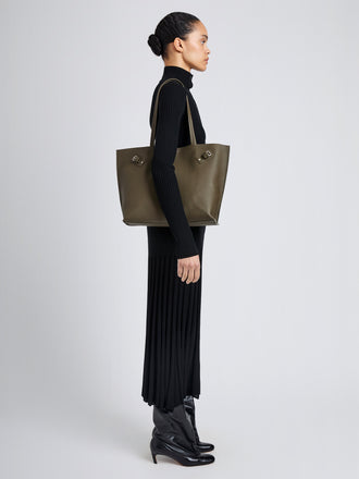 Proenza Schouler Image of model wearing Days Tote in Pebbled Calf Skin in Olive