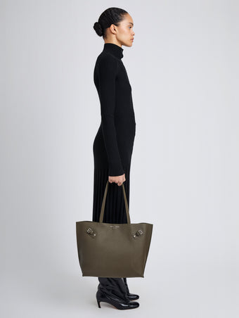 Proenza Schouler Image of model wearing Days Tote in Pebbled Calf Skin in Olive