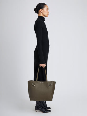 Proenza Schouler Image of model wearing Days Tote in Pebbled Calf Skin in Olive