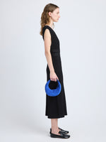 Image of model wearing Mini Slide Bag in Soft Suede in Cobalt