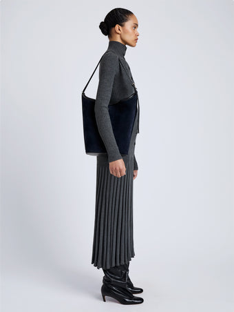 Proenza Schouler Image of model wearing Brant Bucket Bag in Soft Suede in Dark Navy