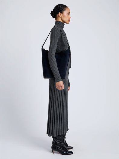 Proenza Schouler Image of model wearing Brant Bucket Bag in Soft Suede in Dark Navy