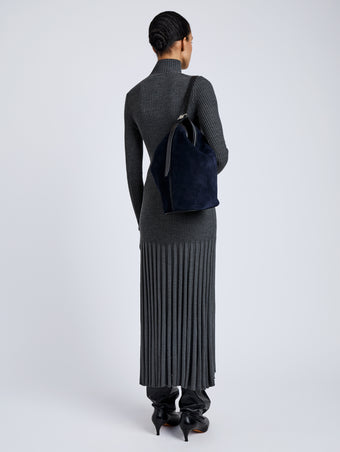 Proenza Schouler Image of model wearing Brant Bucket Bag in Soft Suede in Dark Navy
