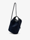 Proenza Schouler Front image of Brant Bucket Bag in Soft Suede in Dark Navy held crossbody