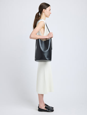 Proenza Schouler image of model wearing Brant Bucket Bag in Smooth Calf in black