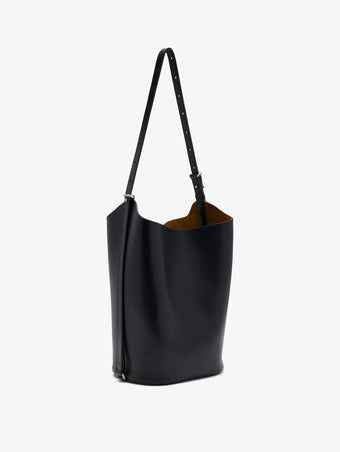 Proenza Schouler side image of Brant Bucket Bag in Smooth Calf in black