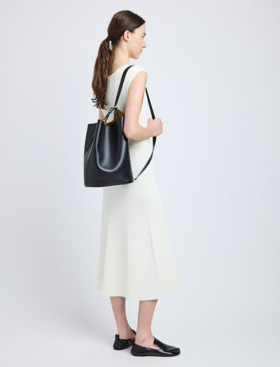 Proenza Schouler image of model wearing Brant Bucket Bag in Smooth Calf in black