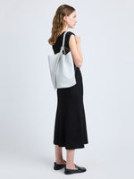 Image of model wearing Brant Bucket Bag in Smooth Calf in Smoke