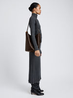 Proenza Schouler Image of model wearing Brant Bucket Bag in Smooth Calf in Chocolate