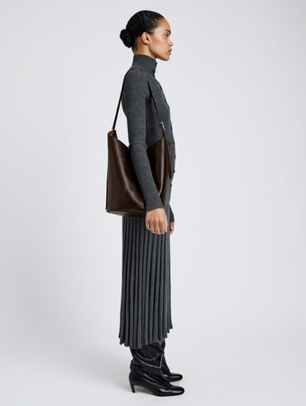 Proenza Schouler Image of model wearing Brant Bucket Bag in Smooth Calf in Chocolate