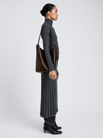 Proenza Schouler Image of model wearing Brant Bucket Bag in Smooth Calf in Chocolate