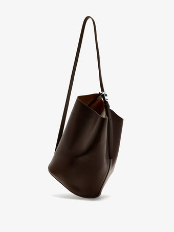 Proenza Schouler Front image of Brant Bucket Bag in Smooth Calf in Chocolate worn crossbody