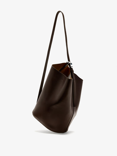 Proenza Schouler Front image of Brant Bucket Bag in Smooth Calf in Chocolate worn crossbody