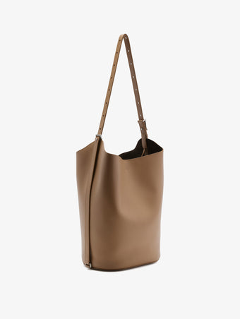 Side image of Brant Bucket Bag in Smooth Calf in Cumin
