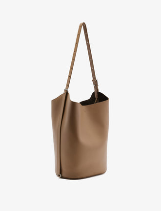 Side image of Brant Bucket Bag in Smooth Calf in Cumin