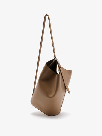 Front crossbody image of Brant Bucket Bag in Smooth Calf in Cumin