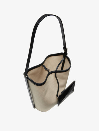Proenza Schouler interior image of Brant Bucket Bag in Natural Linen in natural/black