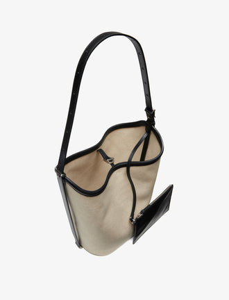 Proenza Schouler interior image of Brant Bucket Bag in Natural Linen in natural/black
