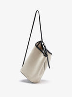 Proenza Schouler crossbody image of Brant Bucket Bag in Natural Linen in natural/black
