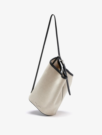 Proenza Schouler crossbody image of Brant Bucket Bag in Natural Linen in natural/black