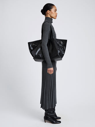 Proenza Schouler Image of model wearing Days Carryall in Paper Calf in Black