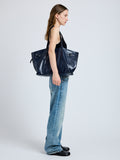 Image of model wearing Days Carryall in Paper Calf in Navy