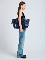Image of model wearing Days Carryall in Paper Calf in Navy