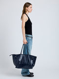 Image of model wearing Days Carryall in Paper Calf in Navy