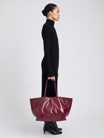 Image of model wearing Days Carryall in Paper Calf in Merlot