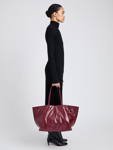 Image of model wearing Days Carryall in Paper Calf in Merlot