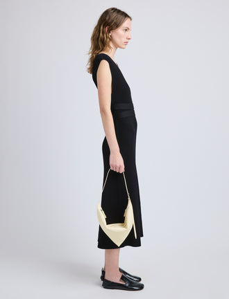 Image of model wearing Tetra Shoulder Bag in Nappa in Resin