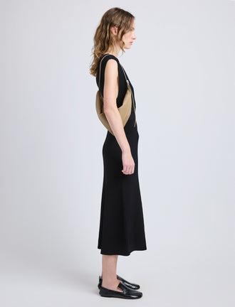 Image of model wearing Tetra Shoulder Bag in Nappa in Cumin