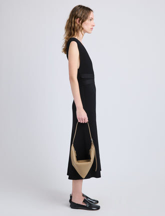 Image of model wearing Tetra Shoulder Bag in Nappa in Cumin