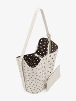 Proenza Schouler Aerial image of Brant Bucket Bag in Eyelet Covered Smooth Calf in Ecru