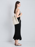 Proenza Schouler Image of model wearing Brant Bucket Bag in Eyelet Covered Smooth Calf in Ecru