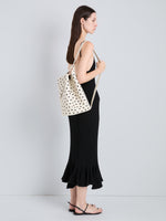 Proenza Schouler Image of model wearing Brant Bucket Bag in Eyelet Covered Smooth Calf in Ecru