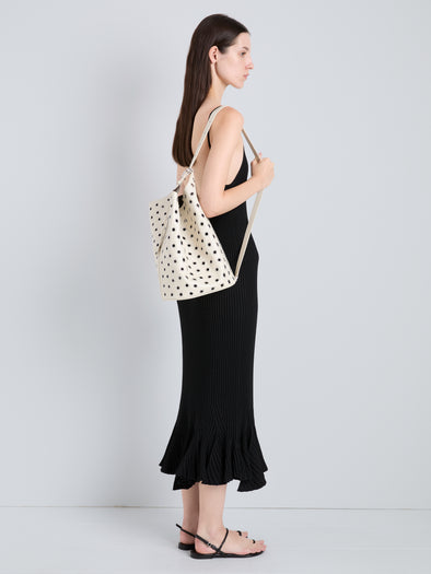 Proenza Schouler Image of model wearing Brant Bucket Bag in Eyelet Covered Smooth Calf in Ecru