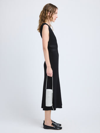 Image of model wearing Silo Bag in Eyelet Covered Nappa in Optic White