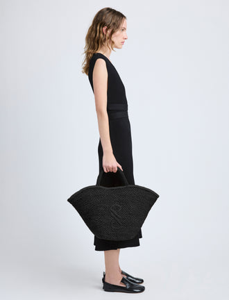 Image of model wearing Large Chelsea Tote in Natural Raffia in Black