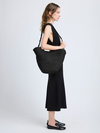 Image of model wearing Large Chelsea Tote in Natural Raffia in Black