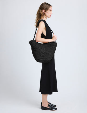 Image of model wearing Large Chelsea Tote in Natural Raffia in Black