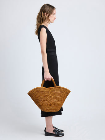 Image of model wearing Large Chelsea Tote in Natural Raffia in Honey