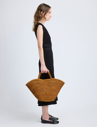 Image of model wearing Large Chelsea Tote in Natural Raffia in Honey