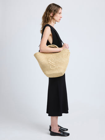 Image of model wearing Large Chelsea Tote in Natural Raffia in Natural