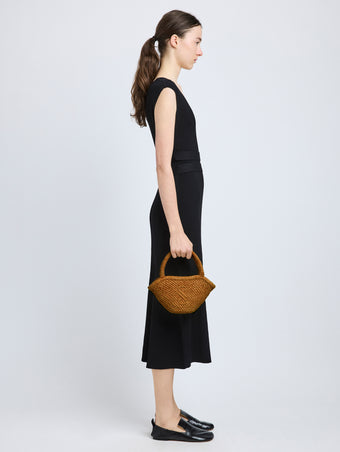 Image of model wearing Small Chelsea Tote in Natural Raffia in Honey