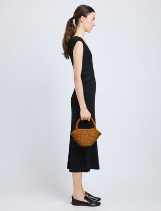 Image of model wearing Small Chelsea Tote in Natural Raffia in Honey