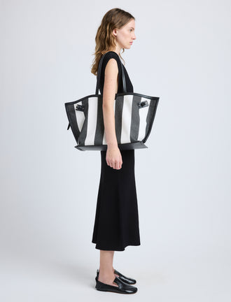 Proenza Schouler image of model carrying Days Carryall in Striped Canvas in black/white