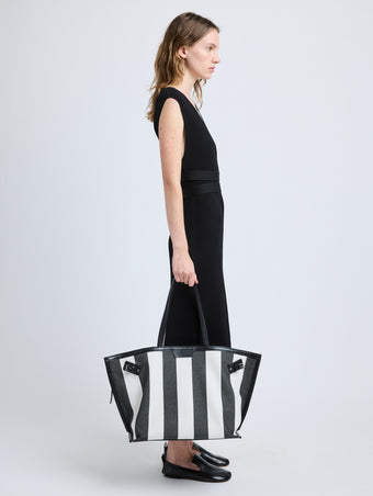 Proenza Schouler image of model carrying Days Carryall in Striped Canvas in black/white