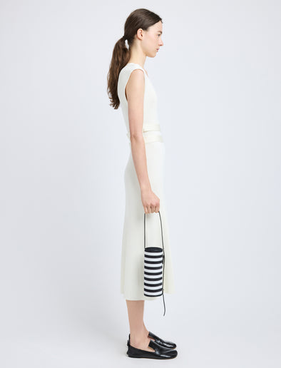 Proenza Schouler image of model carrying Silo Bag in Pieced Stripes in black/white
