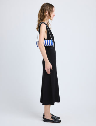 Proenza Schouler image of model carrying Silo Bag in Pieced Stripes in cobalt/white